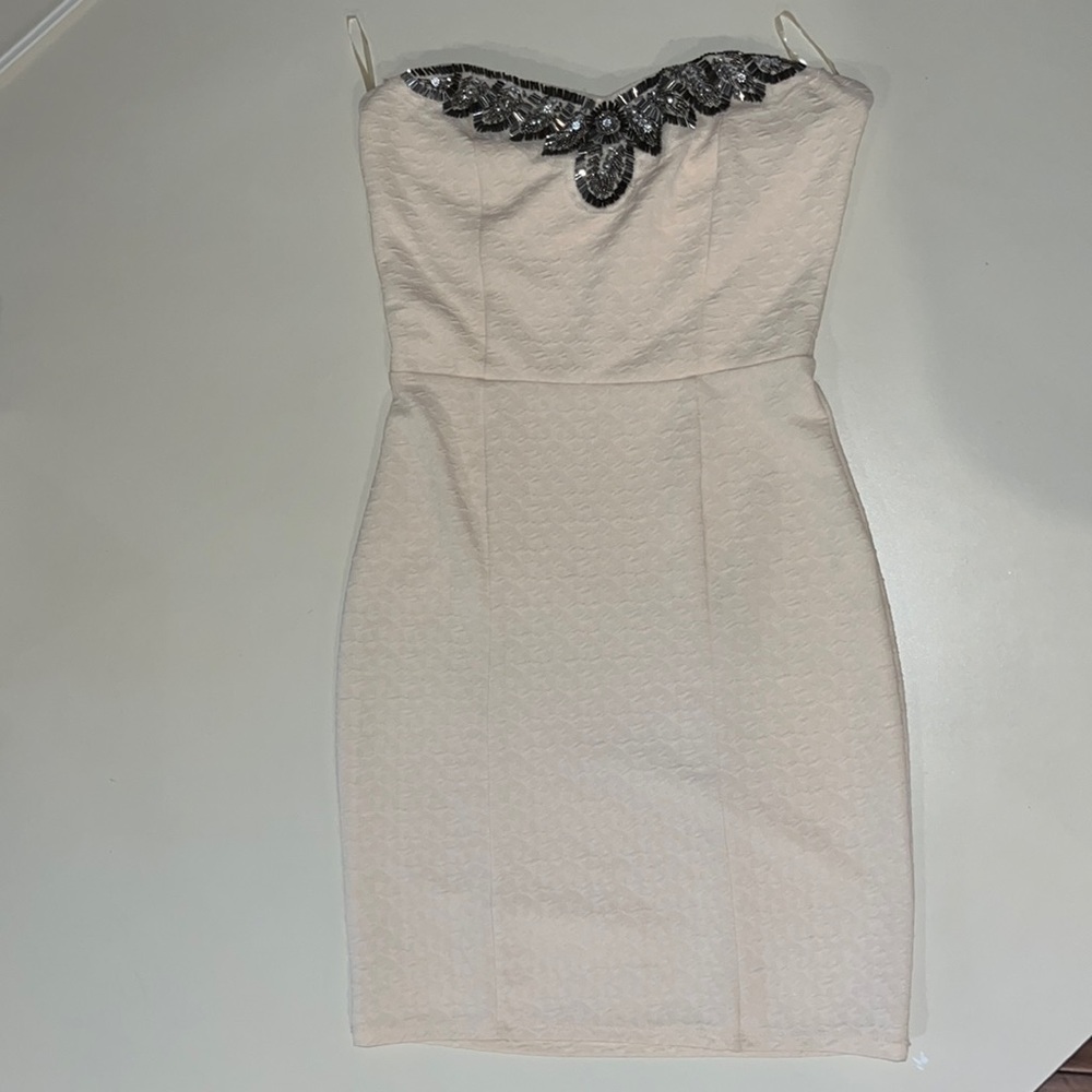 Selling mini dress with neck-line embellishments —like new !